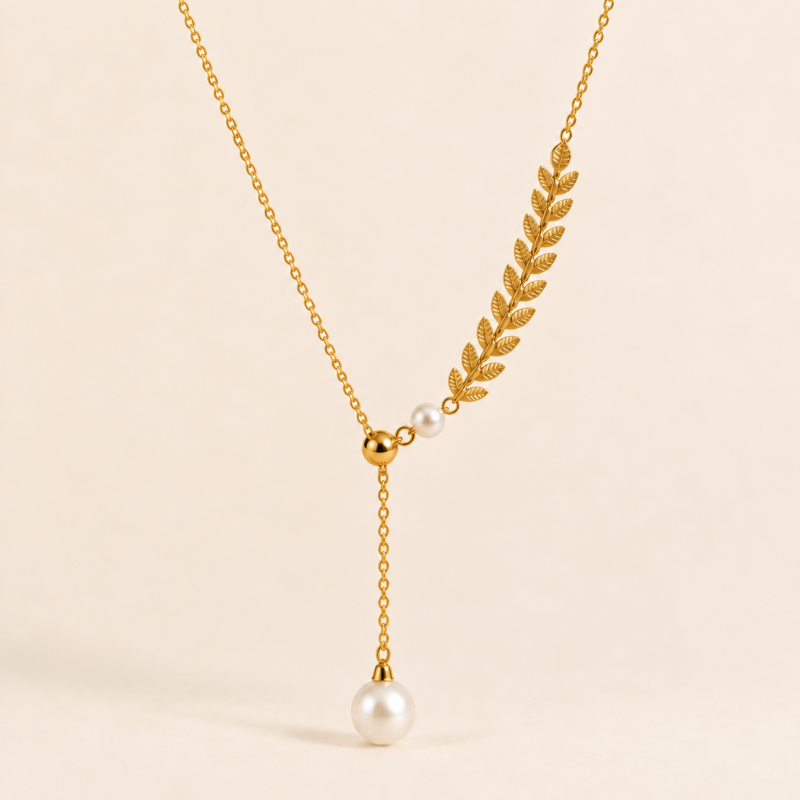 Leaf-inspired pearl drop necklace with elegant gold-tone detailing