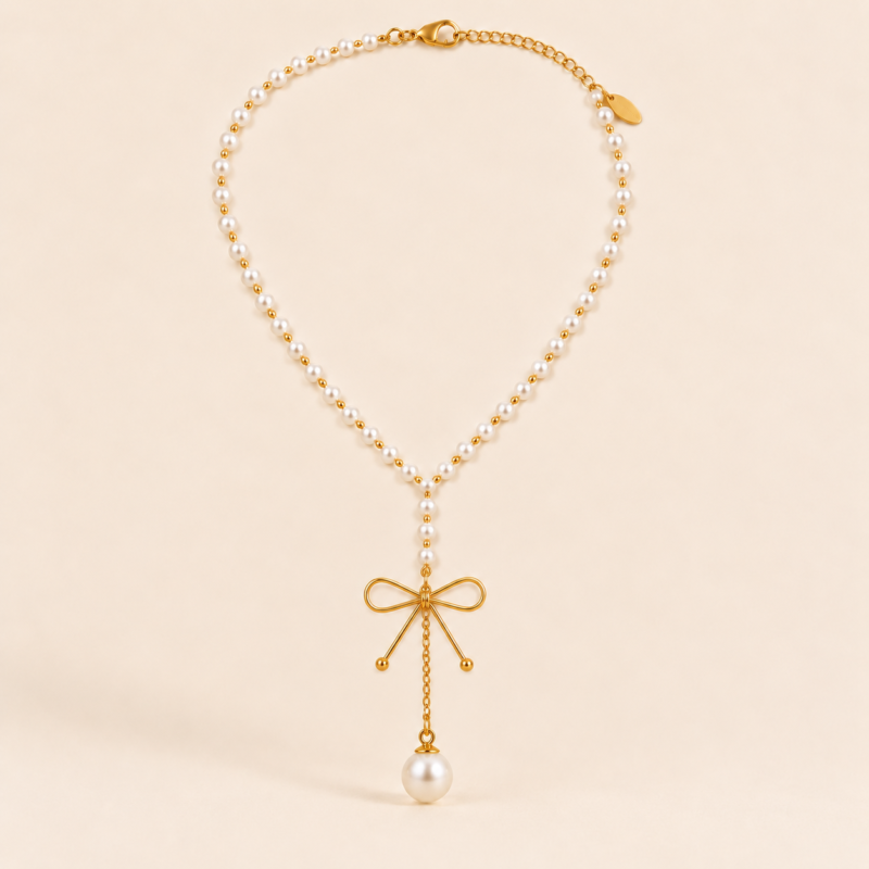 Pearl bow lariat necklace with an elegant drop design